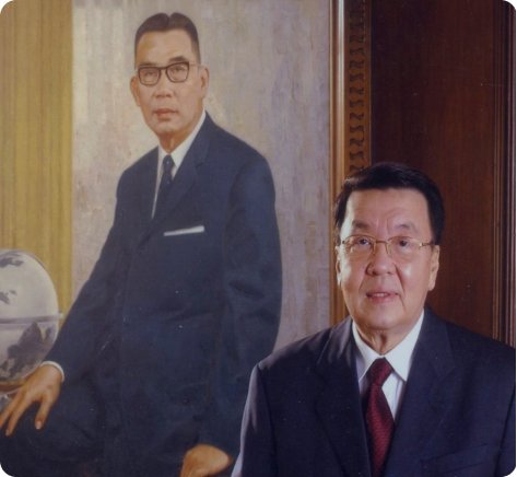 Jose Concepcion JR. stands in front of Jose Concepcion SR.'s portrait - CIC Philippines, - a PSE-listed company